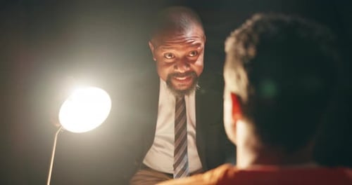 Intense Interrogation Scene with Two Men at Night