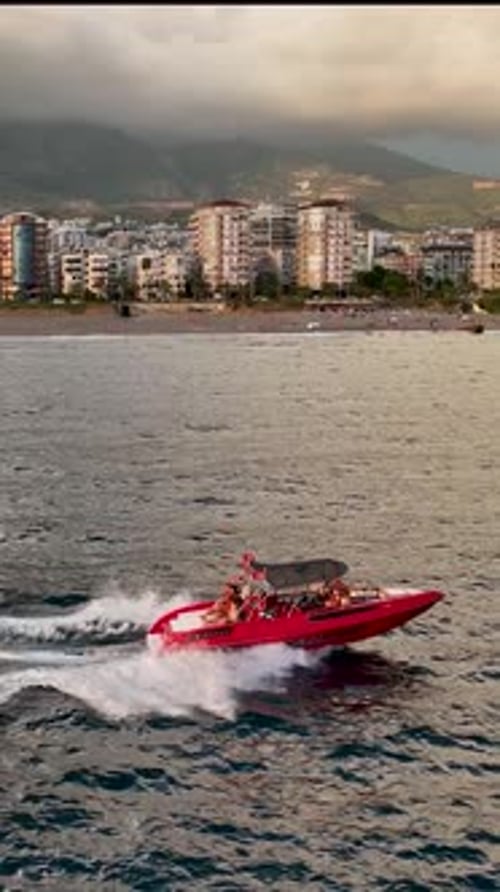 Sports Boat Sails Fast on the Sea Aerial View Vertical Video