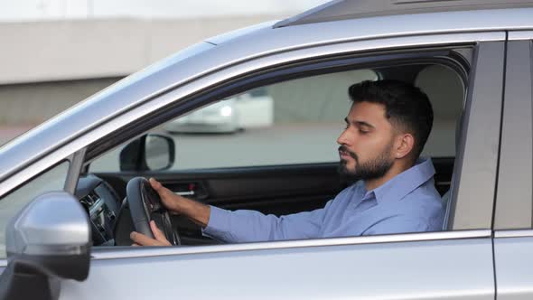 Handsome Serious Driver Looking at Camera While Driving Modern Car ...