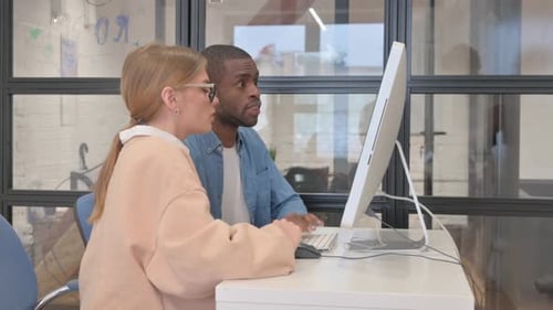 Mixed Race People Working on Computer in Office