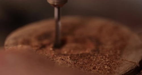 Drill bit boring into wood close up