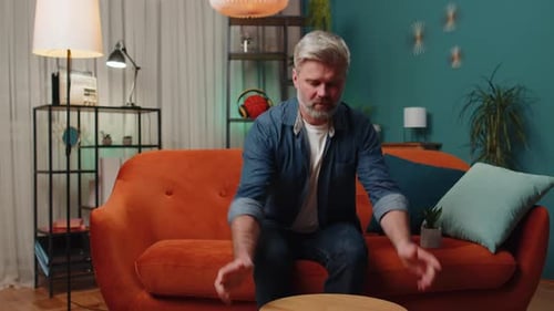 Man Assembling Wooden Table in Living Room