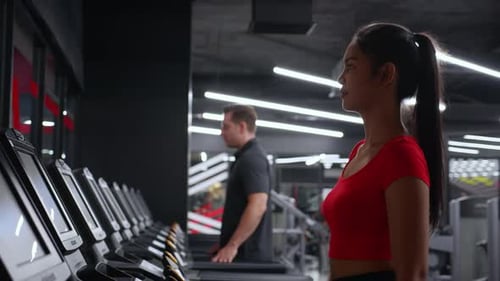 Group people workout with walking and exercise on machine treadmill together in fitness gym.