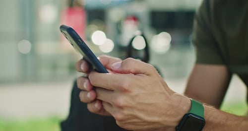 Close Up of Smartphone in Male Hands Outdoors Caucasian Man Tapping and Texting on Mobile Phone