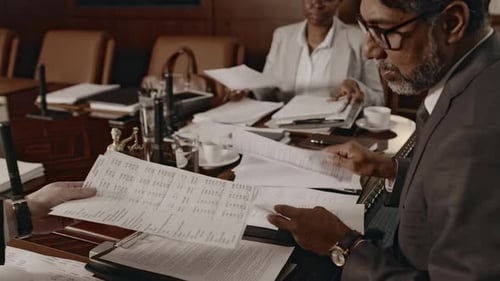 Business Professionals Meeting in Elegant Conference Room