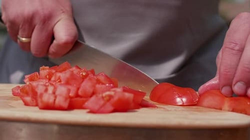 Dicing Tomatoes on a Cutting Board