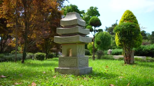 Ornamental Stone Sculpture in Park on Sunny Day