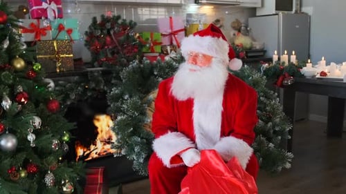 Santa Sits and Gestures by Festive Fireplace