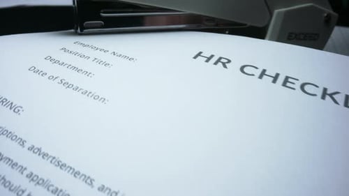 Closeup Clerk Stapling Business Contract in Office. Macro Business Person Fastening