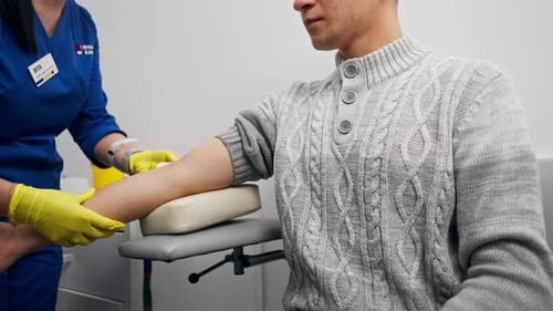 in the Clinic a Guy Asks a Doctor with a Blue Form for Blood Tests Healthy Lifestyle