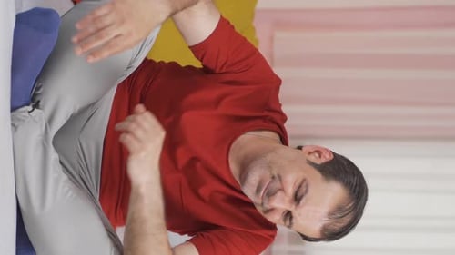 Vertical video of The man who feels physically weak.