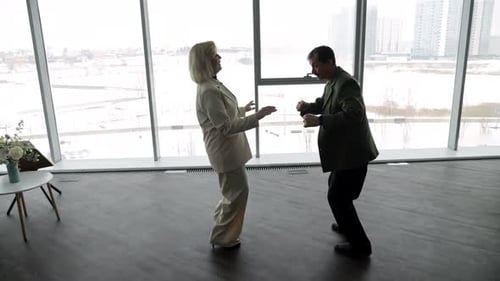 Couple Learning New Dance Moves Indoors Together