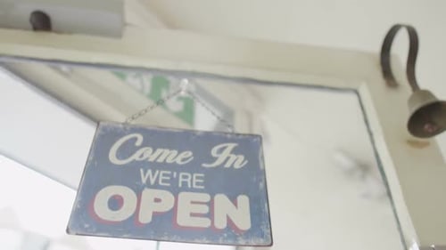 Vintage Come In We re Open Sign Hanging on a Glass Shop Door