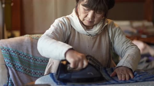 woman ironing clothes
