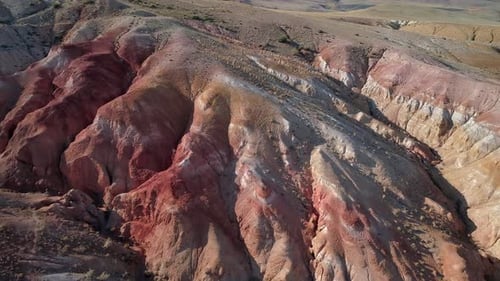 Aerial Tilt Shot of a Beautiful Rainbow Mountains in Altai Region Russia Geological Formation Called