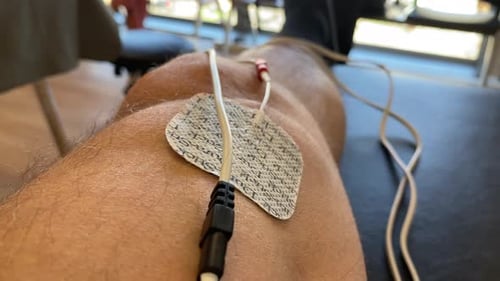 Male Leg Gets Electroshock Therapy for Muscle Developement, Close Up