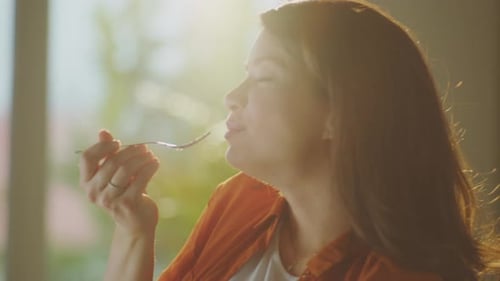 Pregnant Woman Eating Healthy Food at Home