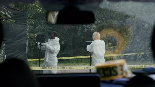 Crime Scene Investigated by People in Protective Suits