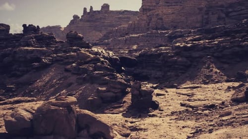 Sunset Silhouettes Highlight Ancient Mesa Remnants Against Sky