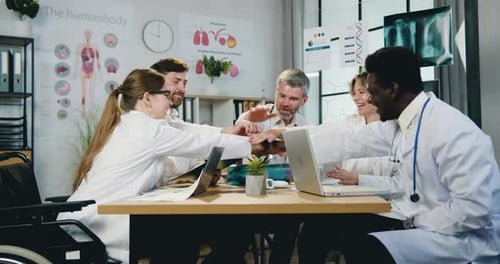 Medical Team Celebrates Success in Bright Office