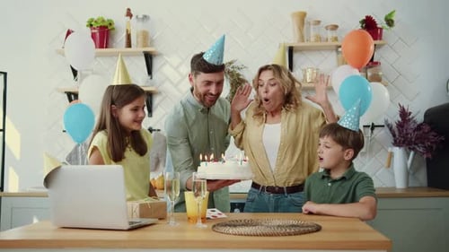 Happy Family Celebrating Birthday in Kitchen