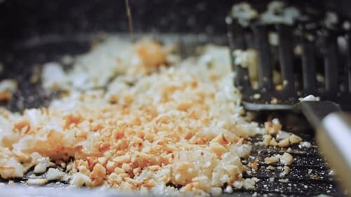 Chopped Nuts Poured Onto Rice Close Up