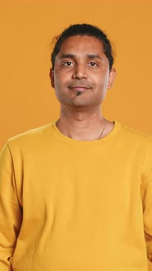 Portrait of Cheerful Friendly Man Smiling Studio Background