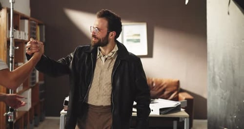 Successful On-Set Celebration Among Colleagues