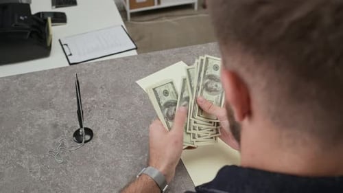 Man Counting Banknotes Visiting Bank Office