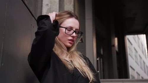 Sexy Fashion Model Long Loose Blonde Hair Fly in Wind Motion at Urban City