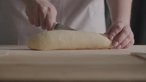 Woman Hands Close Up Kneading Dough on Floured Table Preparing Home Made Sourdough Bread