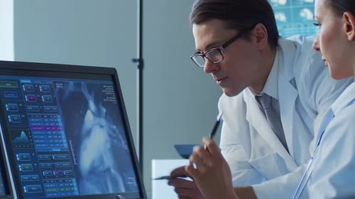 Professional Medical Doctors Working in Hospital Office Making Computer Research Medicine Healthcare