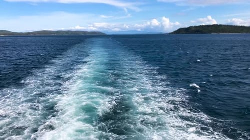 Foamy Wake In Blue Ocean Created By Cruising Vessel. POV, slow motion