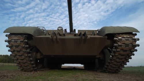 Imposing Military Tank in Rural Landscape