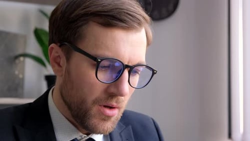 Adult Caucasian Angry Businessman Tired in Office at Desk Stressed with Paperwork Deadline Upset