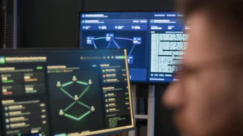 Network Engineer Analyzing Codes on Computers in Cybersecurity Office