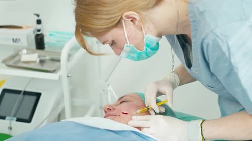 Woman Receives Facial Injection in Medical Office