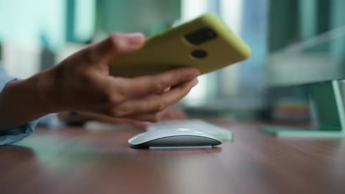 Woman Typing then Holding Smartphone at Office Desk