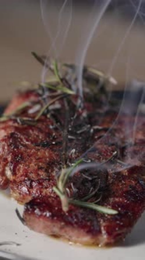 Delicious Steak Served with Rosemary Garnishing on Plate