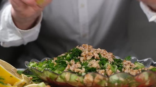 Squeezing Lemon on Salad