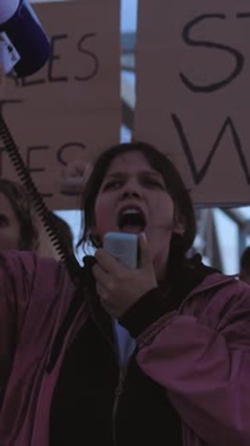 Woman Shouts Into Megaphone at Protest