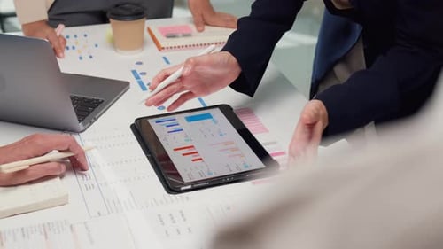 Team Reviewing Data Together in a Modern Office
