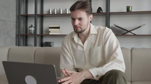 Man Using Laptop in His Office