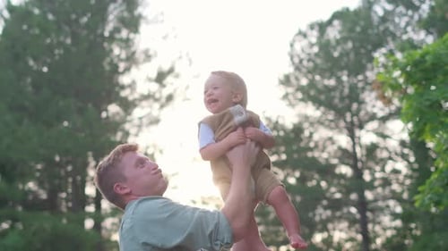 Dad Throws Son Playing with Child Dad Plays with Child in Park Son Dreams of Flying and Being a