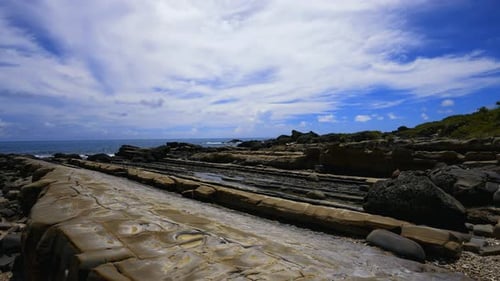 The erosion of the ocean and weathering. Forms strange rocks and stones.