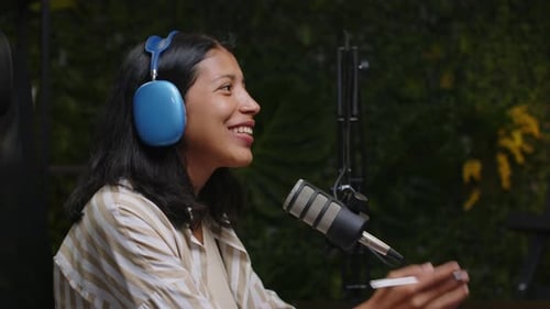 Smiling Woman Recording Podcast Wearing Headphones
