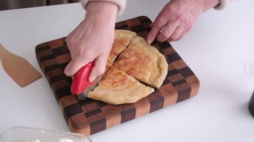 Cutting a Cheesy Pie with Pizza Cutter