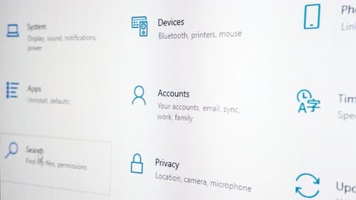 Mouse pointer moving over various setting icons in Windows 10. Screen close up