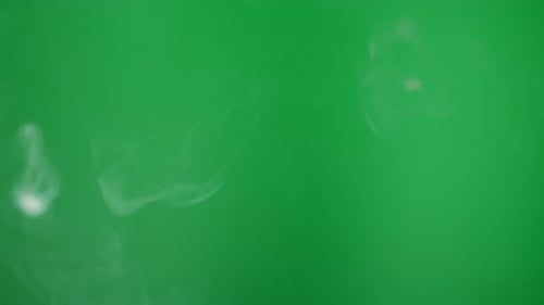 Smoke on Green Chroma Key Background Smoking Steam Clouds of Vapour Closeup Burning Fog