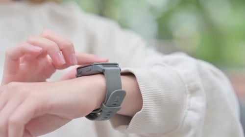 Close up of Woman Using Smart Watch Outdoor